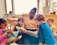 preschool teacher reading to students